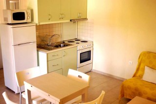 Fully equiped small kitchen with double bed sofa